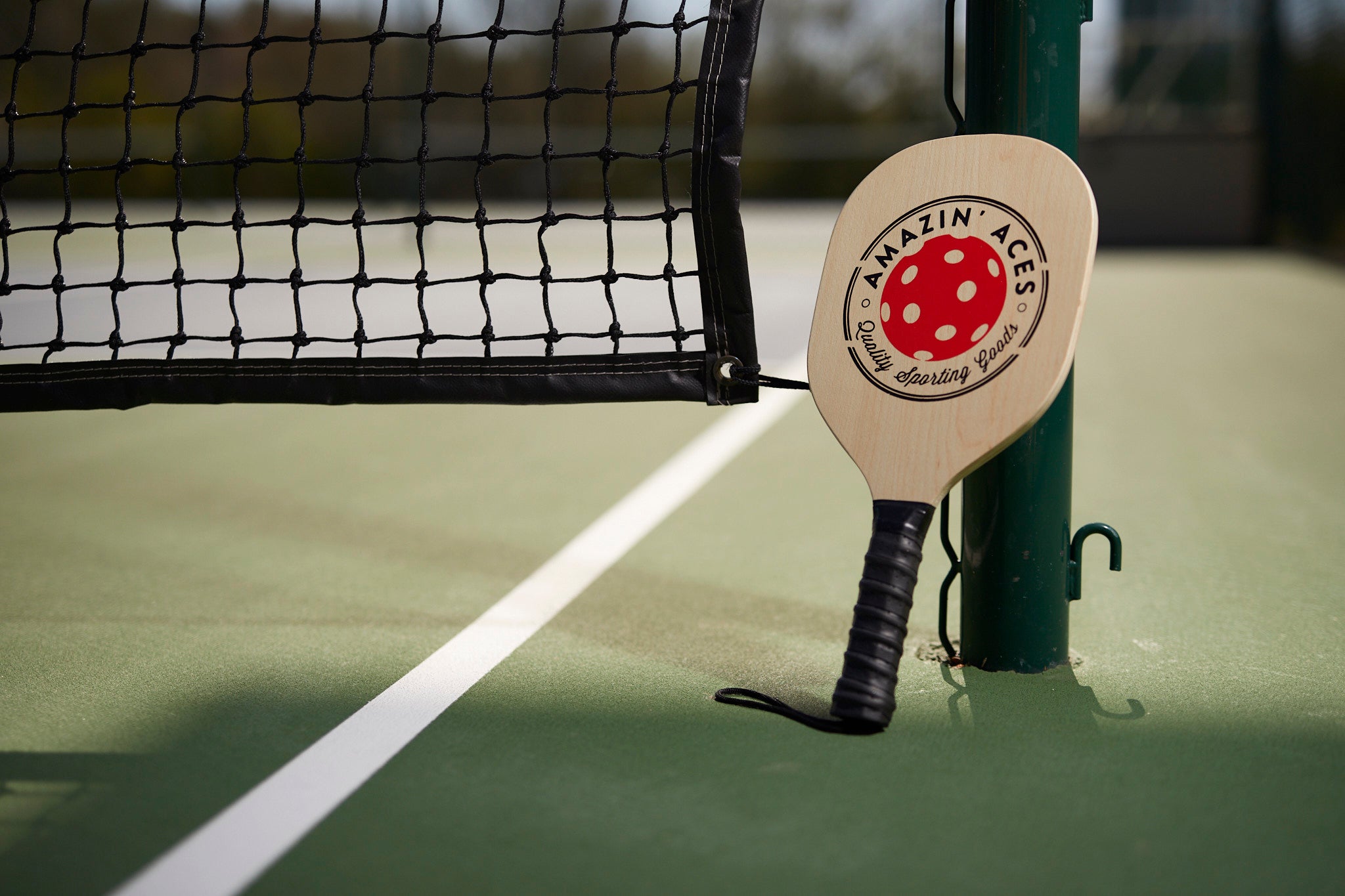 Wood Pickleball Paddle on Pickleball Court